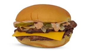 Double-patty cheeseburger with cheddar, pickles, onions, and creamy sauce on a toasted bun.